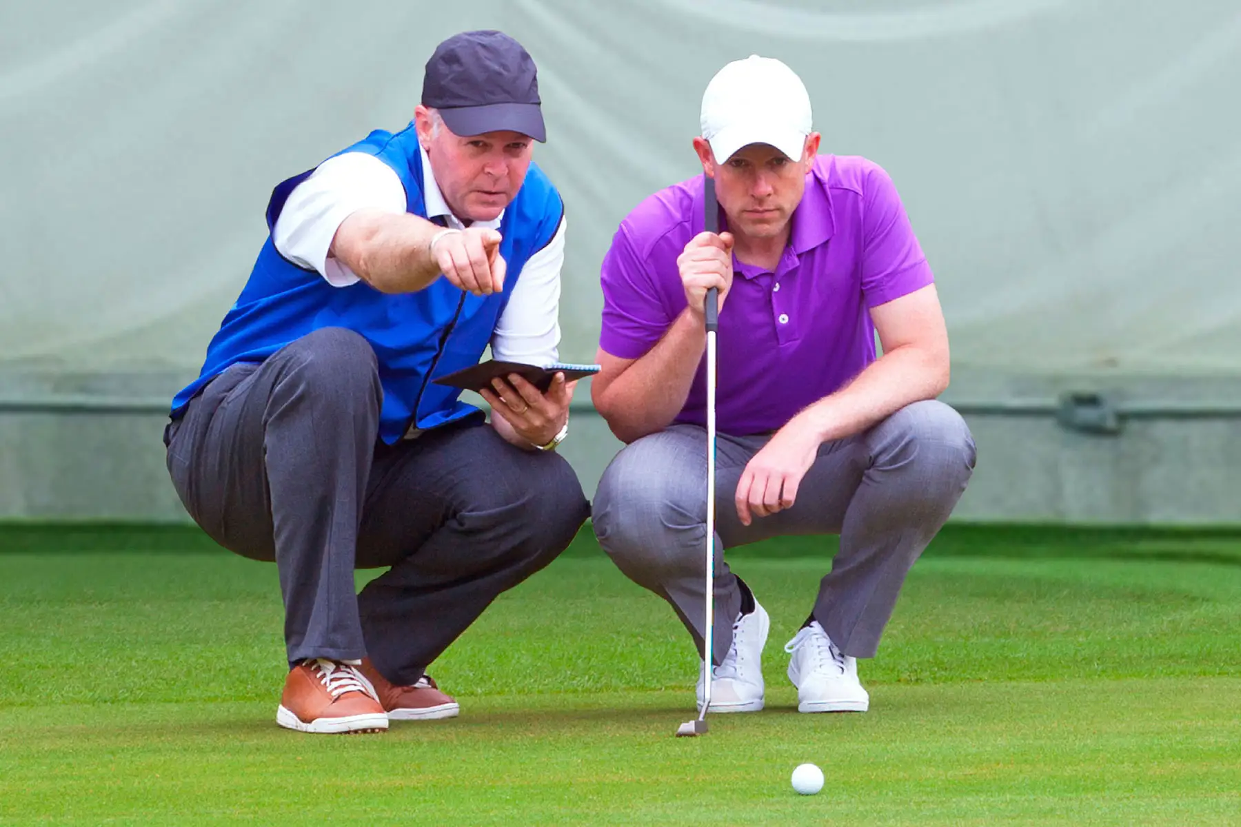 Golfers on a putting green