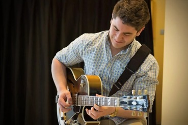 Theo Curtin playing guitar