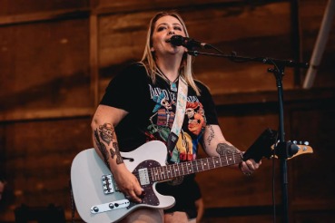 April Cushman playing guitar